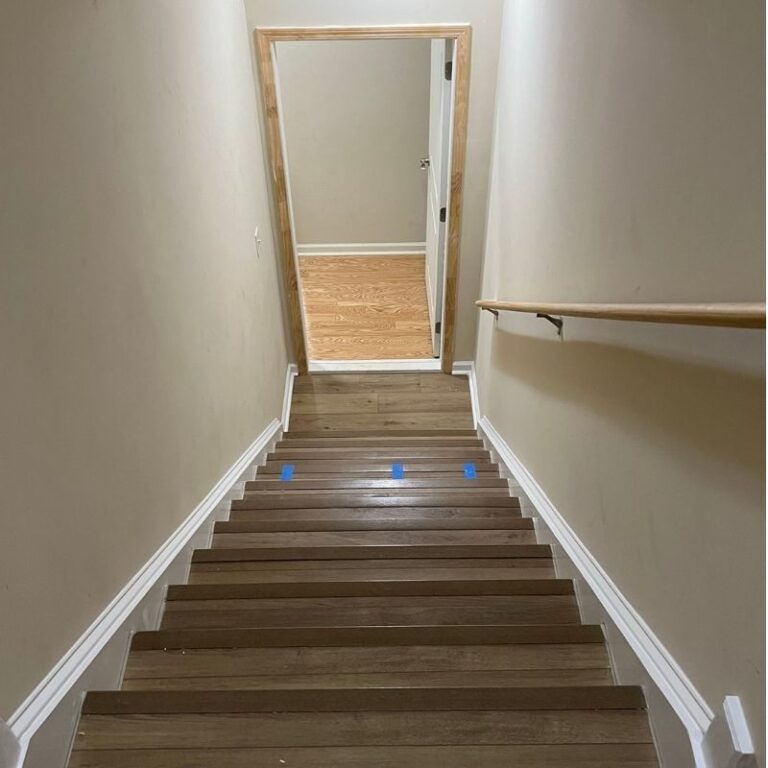 After photo vinyl plank flooring installed on stairs by tide & timber Ocala, FL